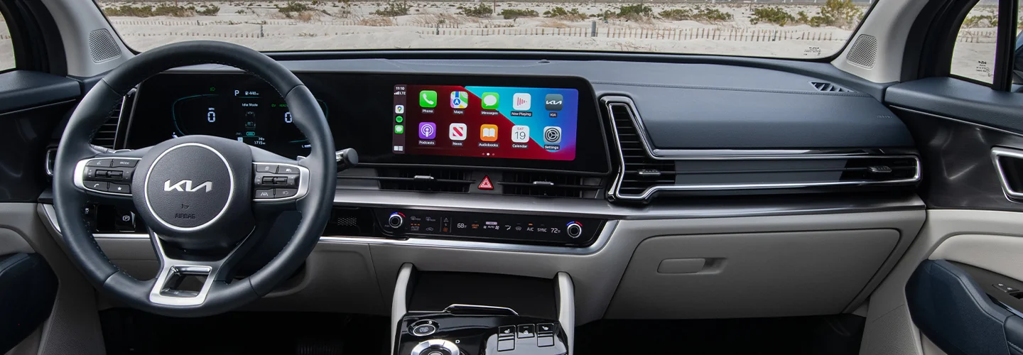 Interior view of the dashboard of a 2025 Kia Sportage Hybrid