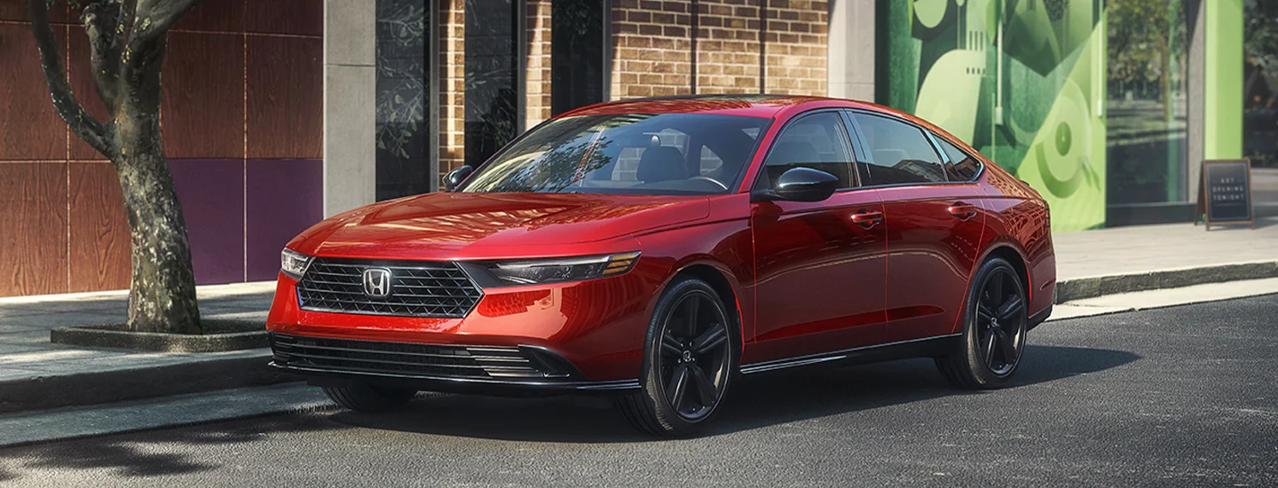 red 2025 Honda Accord parked on street