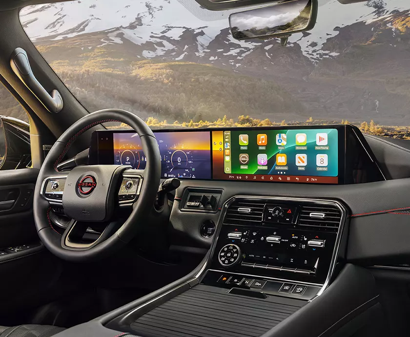 a Nissan Armada's interior showing the front cockpit area