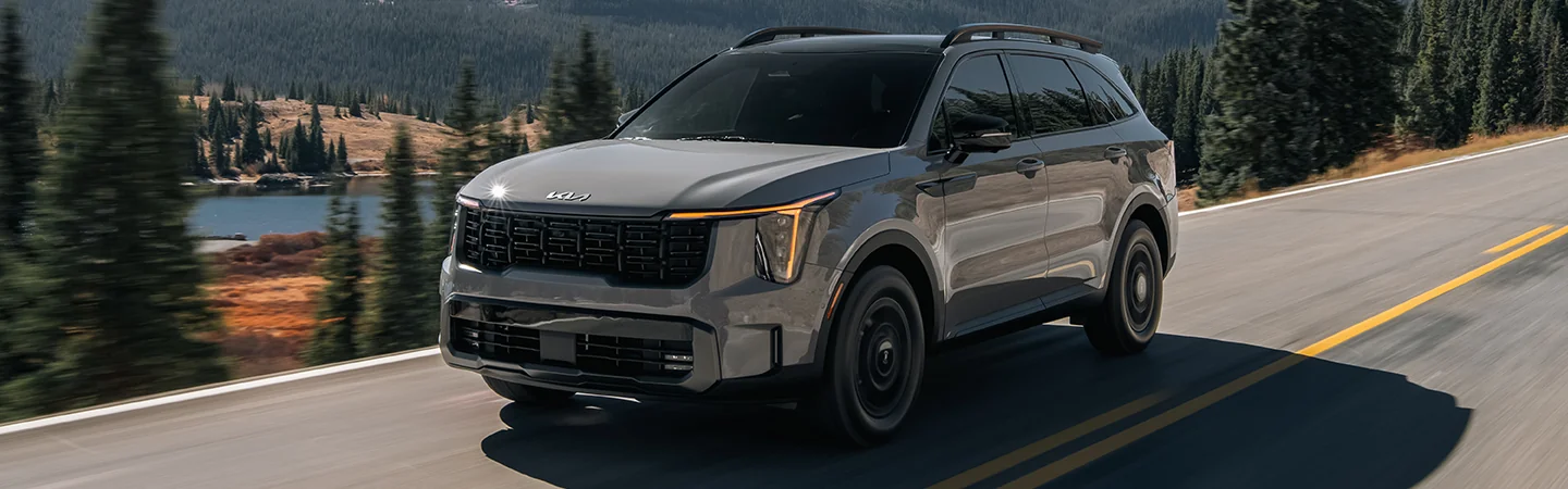 gray 2025 Kia Sorento driving on hills