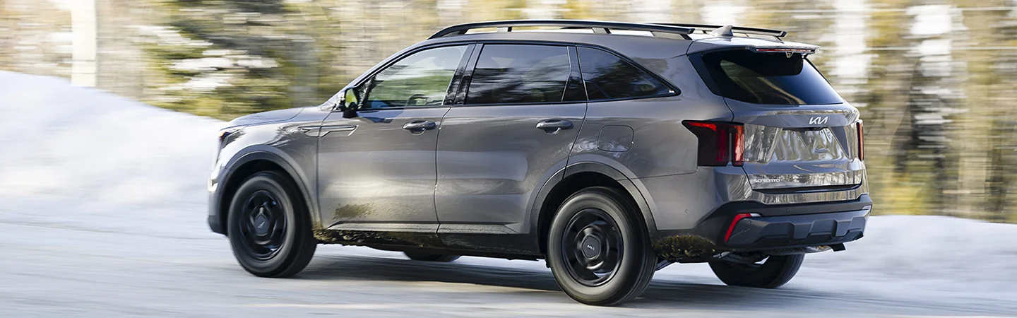 gray 2025 Kia Sorento driving on snow road