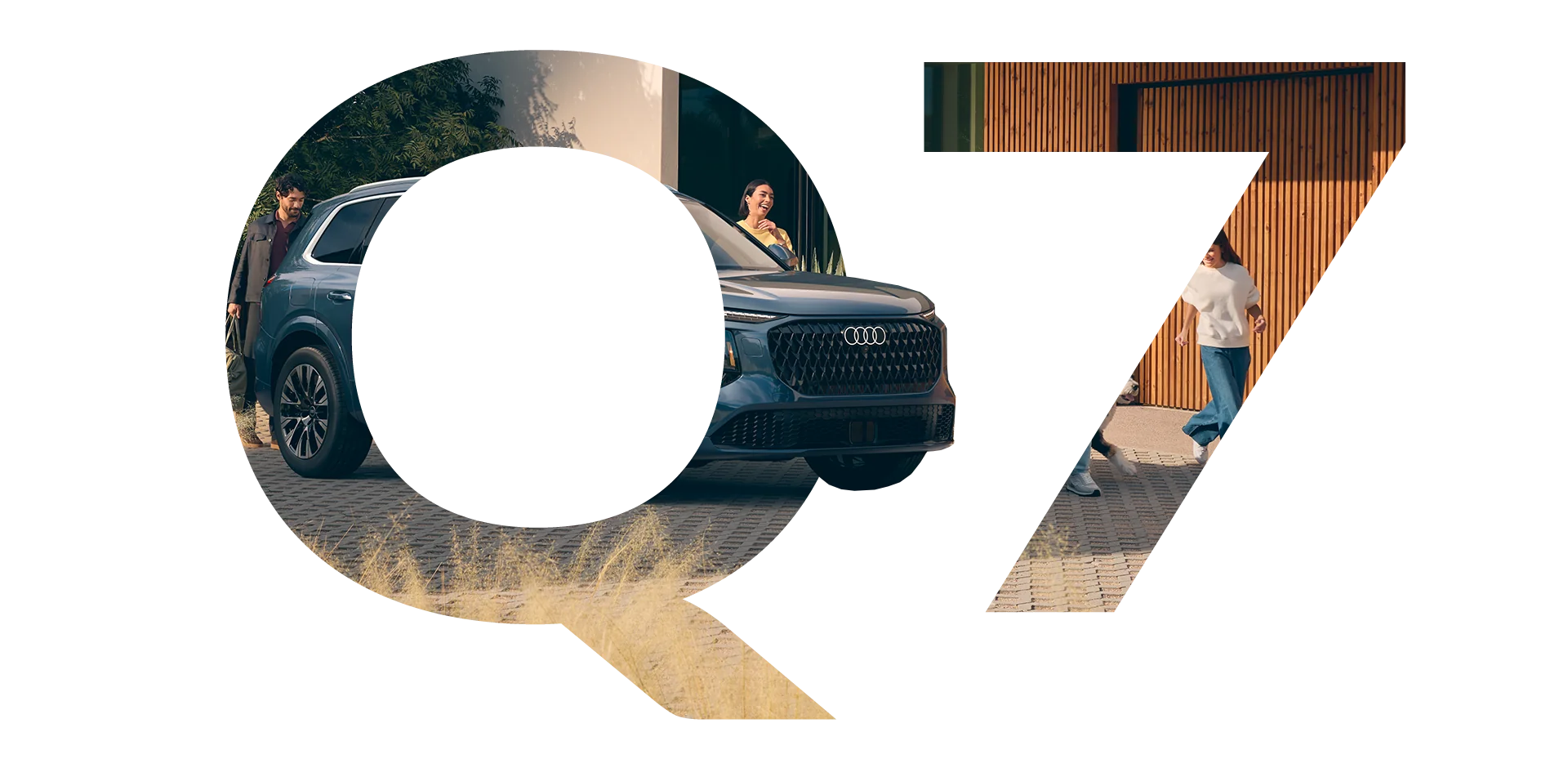 Q7 graphic letters with happy owners boarding car