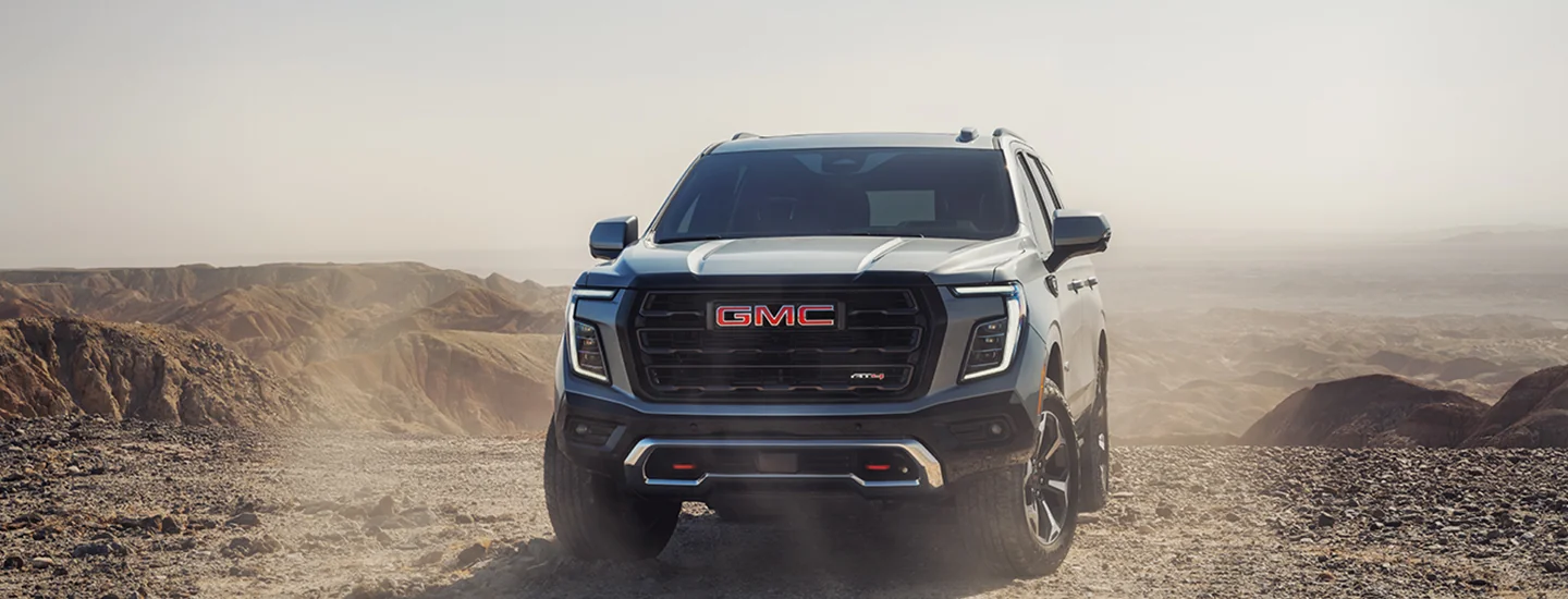front view of a parked 2025 GMC Yukon in the middle of no where