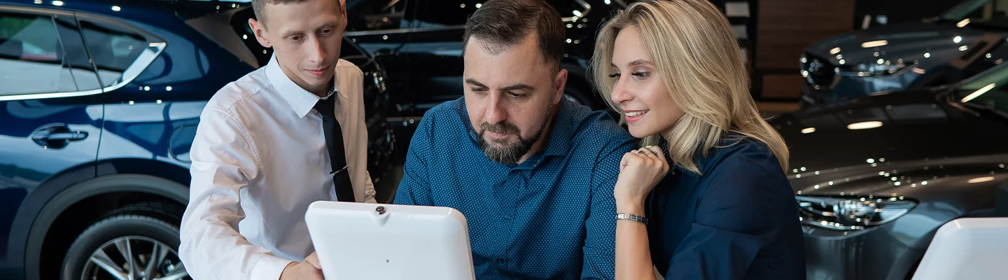 people in car showroom