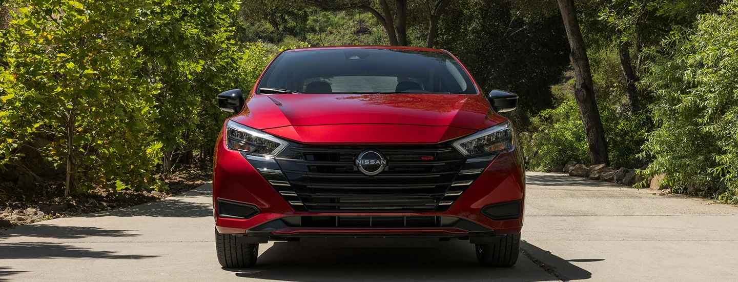 front view of a red 2025 Nissan Versa