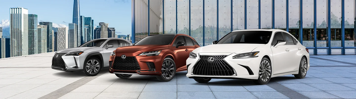 Lexus model line up with a city in the background