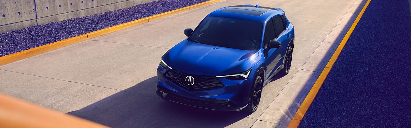 2025 Acura ADX driving on a city road