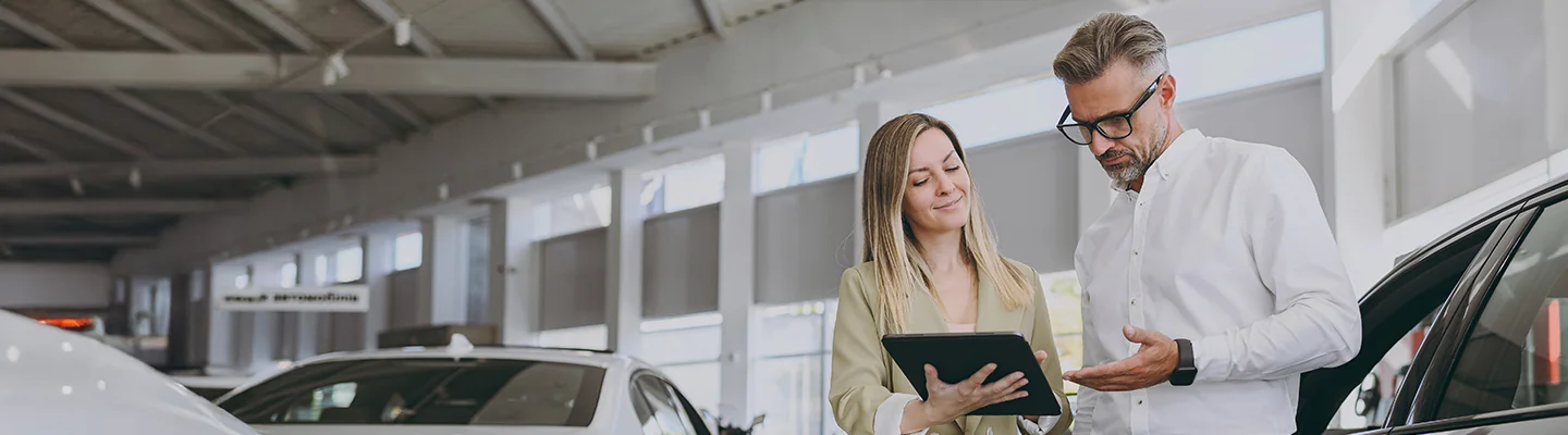 two people discussing the trade in of a car