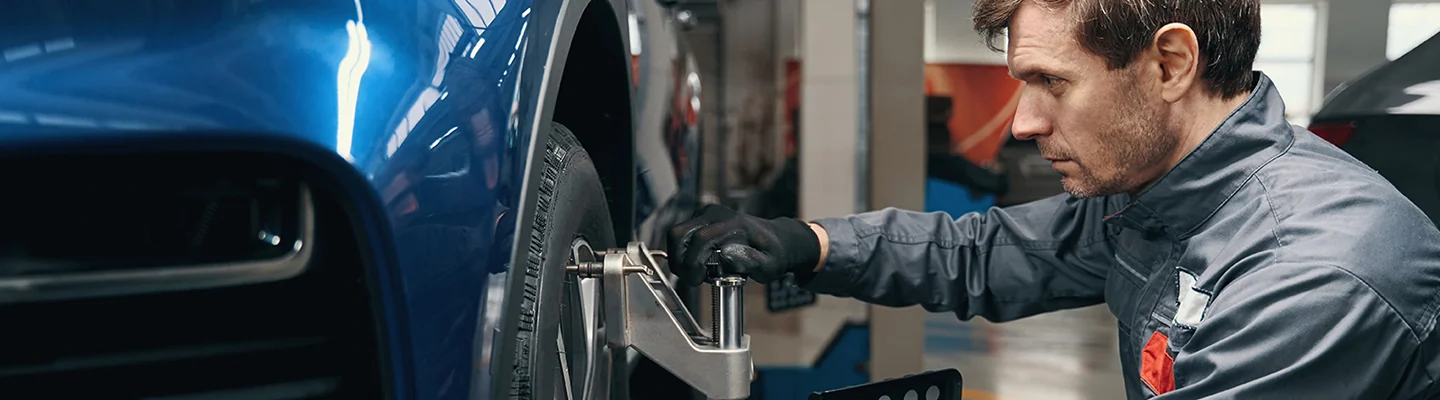 Service technician working on the brakes of a Hyundai