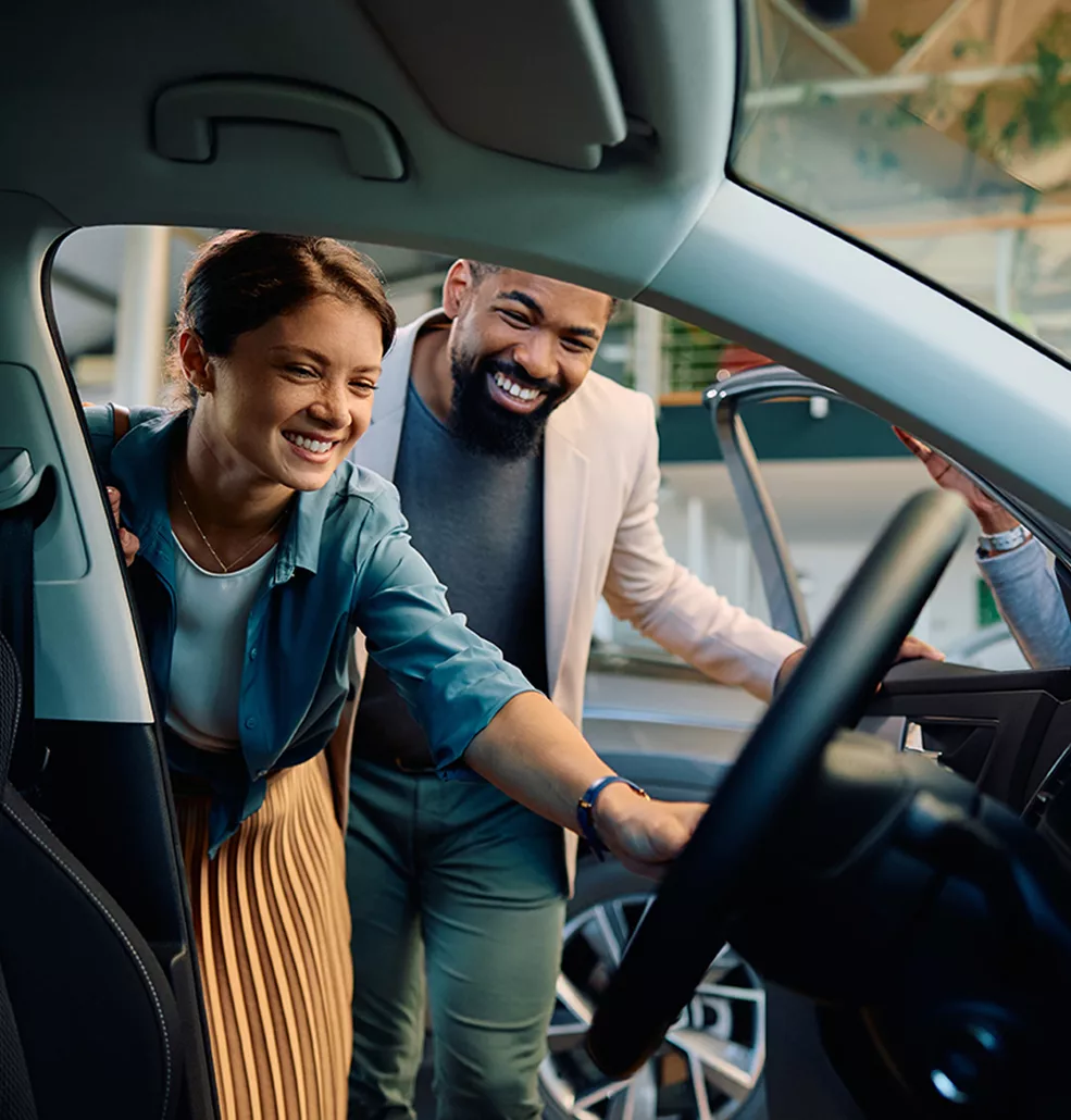 customers looking inside new car