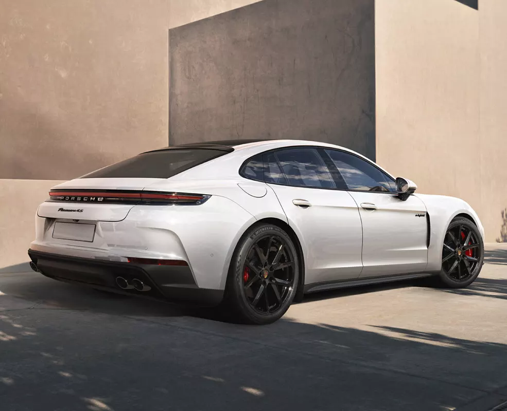 a white 2027 PORSCHE PANAMERA exterior view from rear parked in city