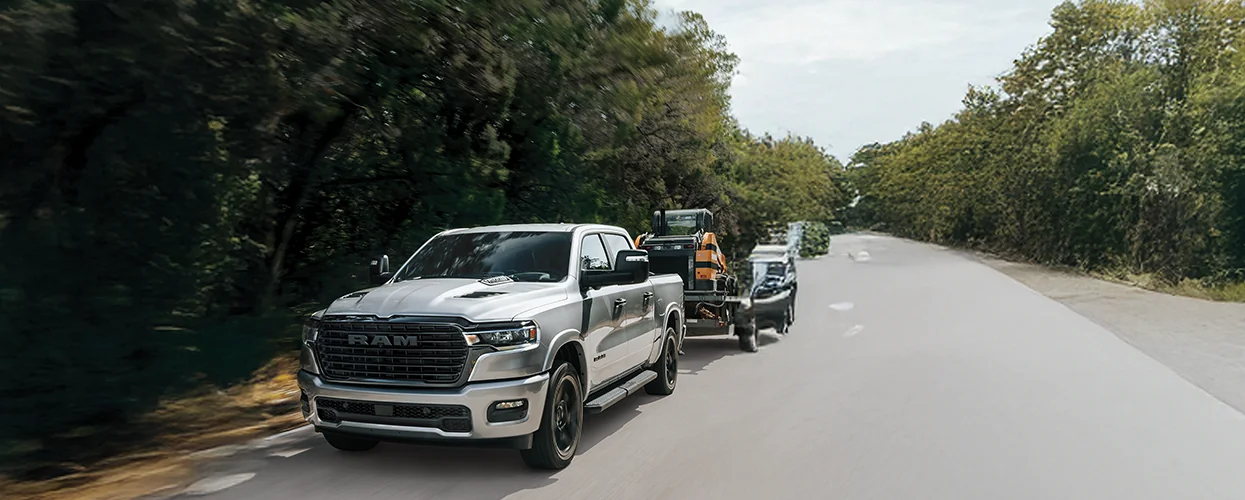 RAM 1500 towing some work equipment