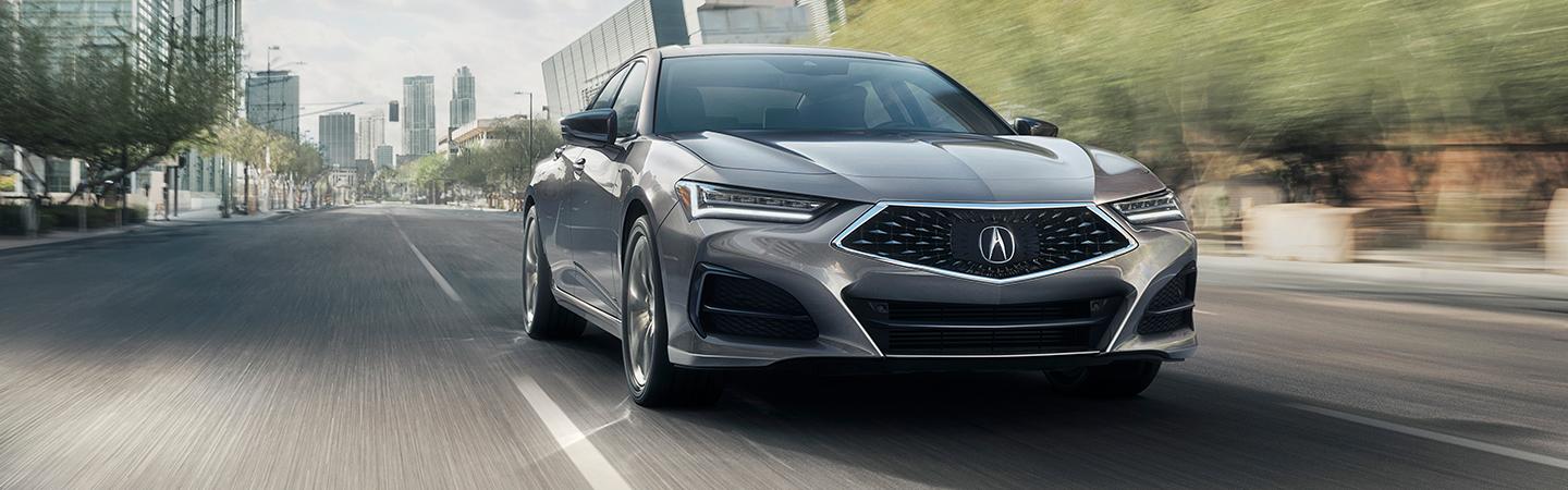 silver Acura driving