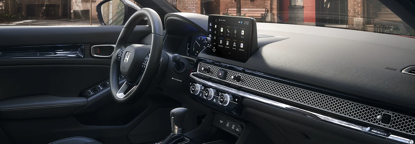 Interior view of the dashboard and tech of a 2025 Honda Civic Sport