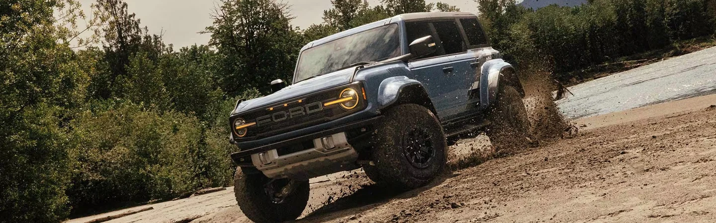 2024 Subaru Outback vs 2024 Ford Bronco grey color and front view