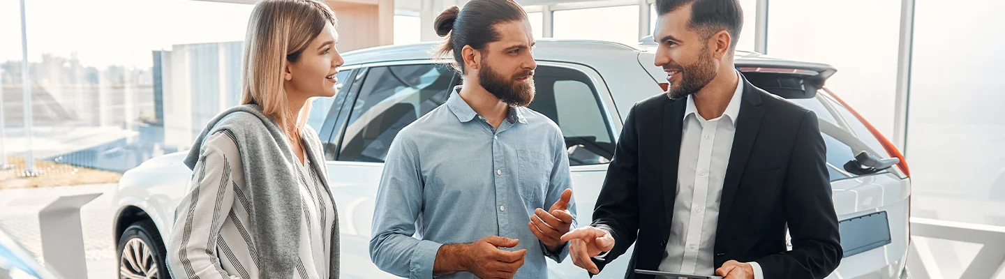 couple speaking with car salesperson about the Santa Cruz features