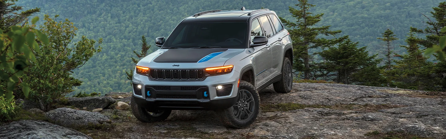 2025 Jeep Grand Cherokee Sliver color car on mountain