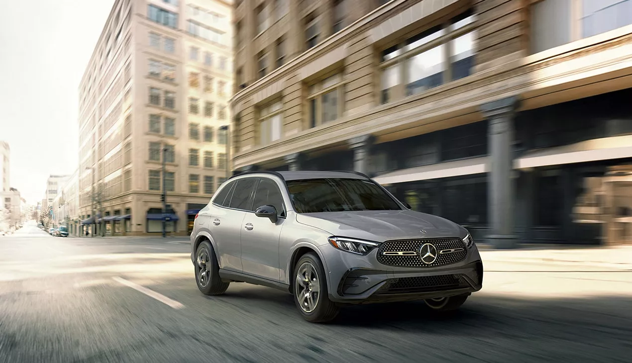 Side view of a gray Mercedes-Benz driving in the city