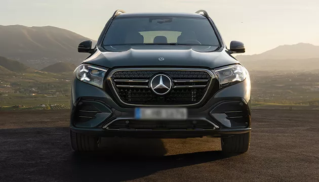 Front view foa black Mercedes-Benz parked in the mountains