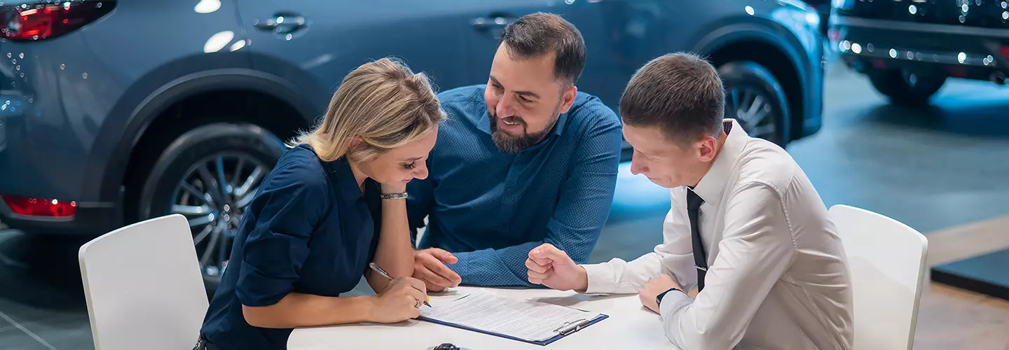 people shopping for a new car at our dealership showroom