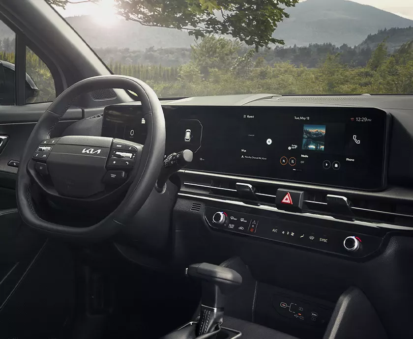 Interior view of the dashboard and tech in a 2026 Kia Sportage Hybrid in Murphy, NC