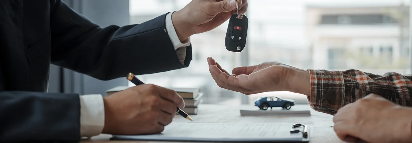 man handing keys over