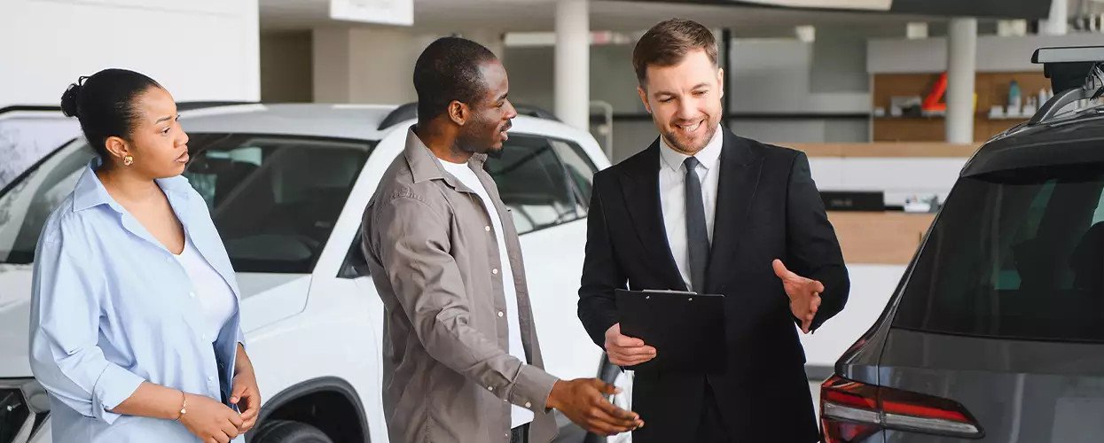 people car shopping in showroom