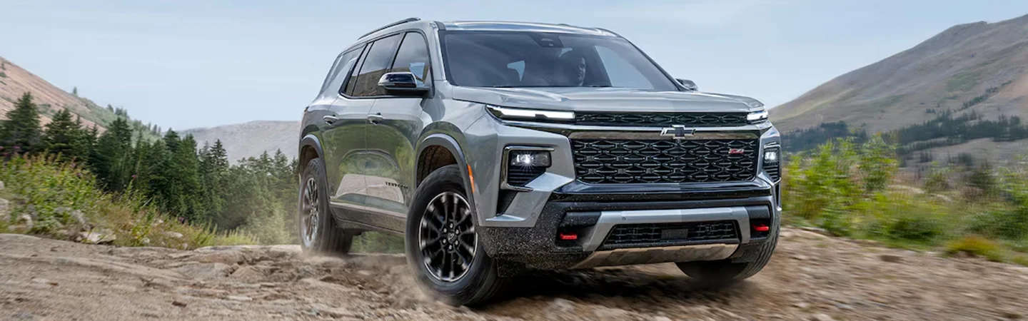 2025 Ford Explorer vs 2024 Chevrolet Traverse front side in green