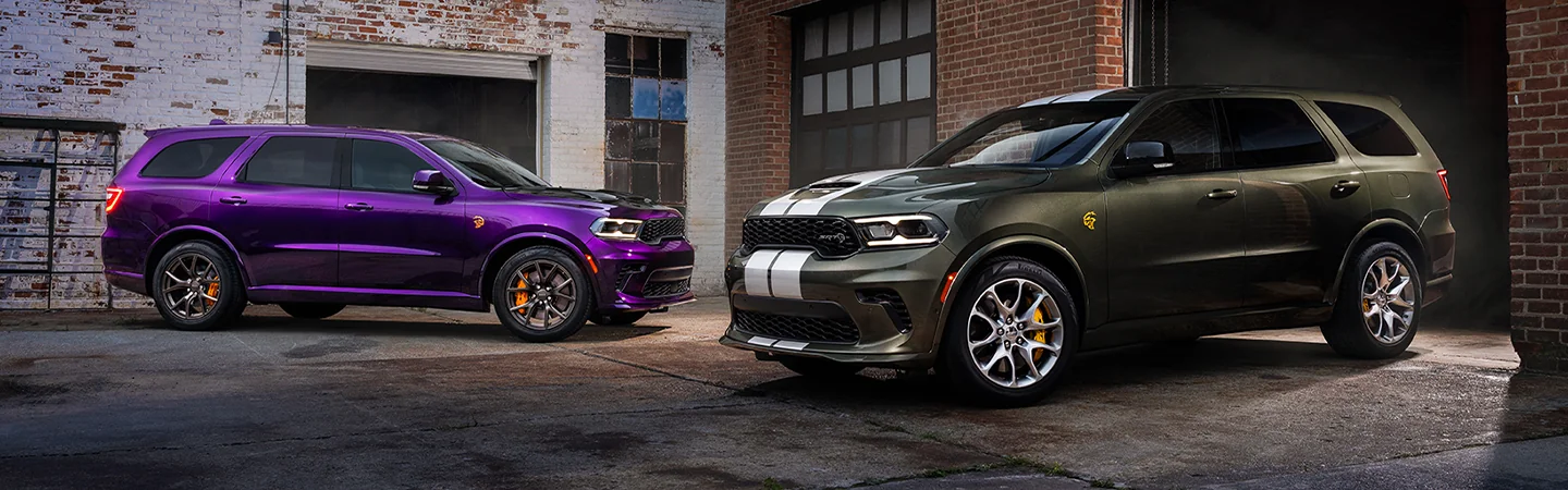 Side view of 2 parked 2026 Dodge Durango in a back ally