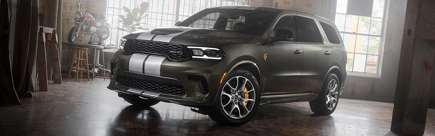 Front view of a praked gray 2026 Dodge Durangoin a studio