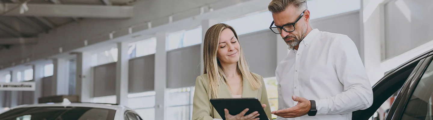 man and woman looking at papers