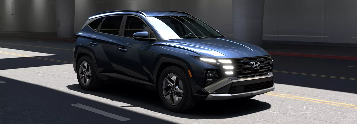 2026 Hyundai Tucson driving on a city street