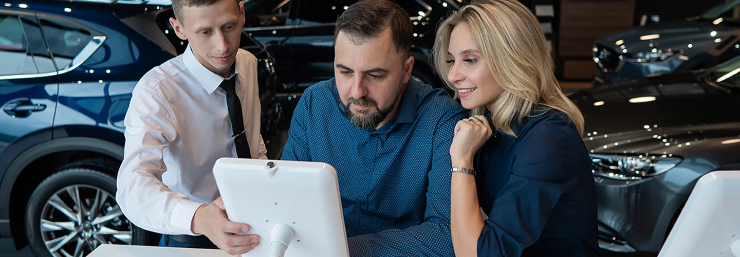 couple going over the detyails of a Lamborghini Financing plan