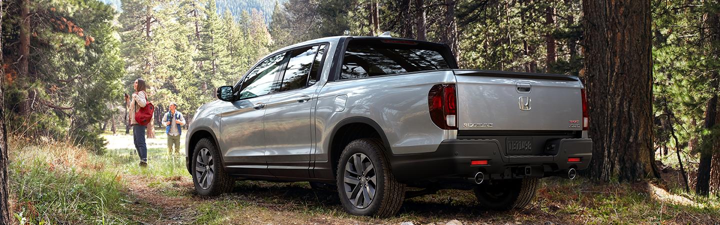 Silver 2021 Nissan Ridgeline in the woods