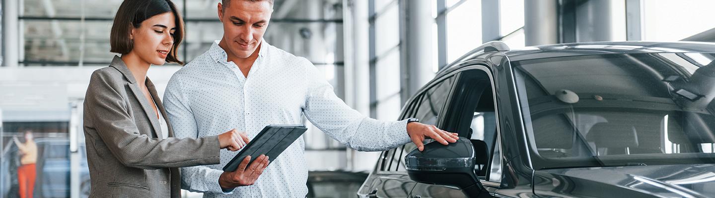 people new car shopping in showroom