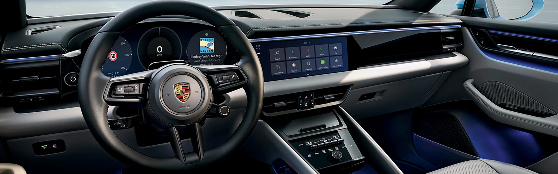 Interior view of the front seat dashboard and texh of a 2026 Porsche Macan