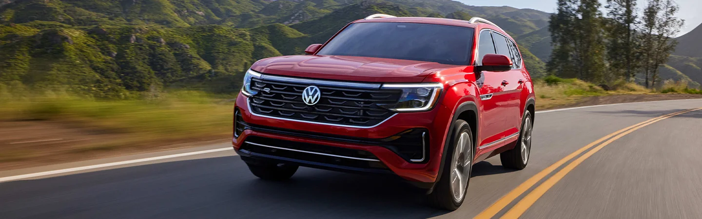 2025 Volkswagen Atlas driving down a country road