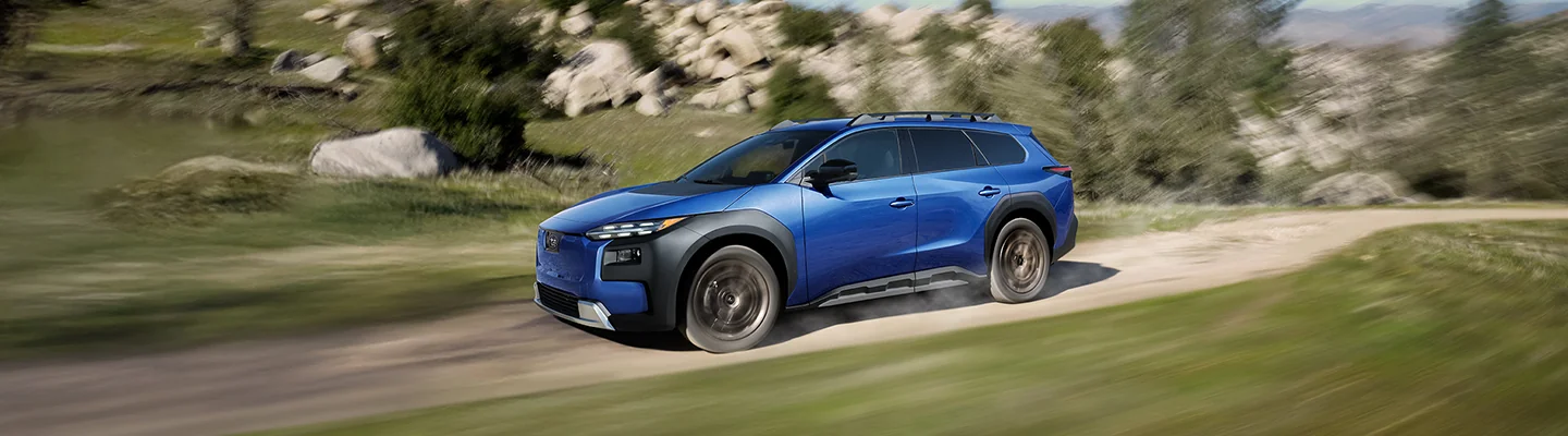 a blue Subaru in motion