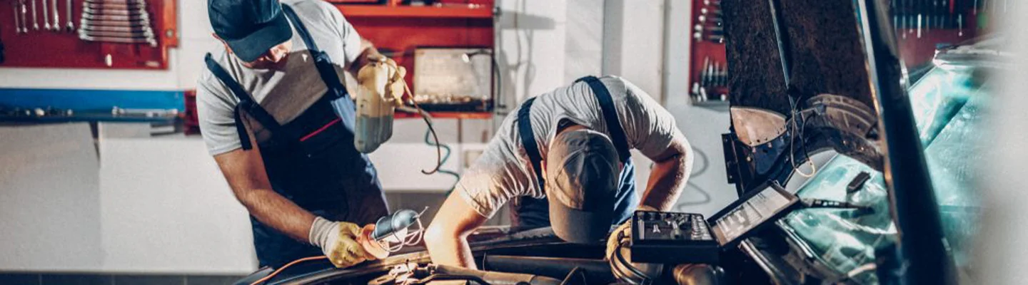 2 mechanics working under hood