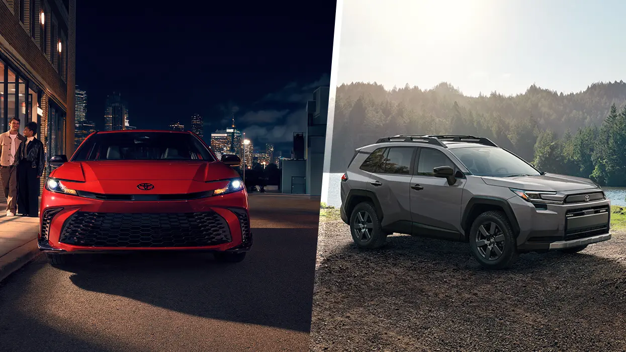 car salesperson showing lease details to customer sitting in car