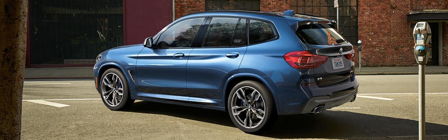 Angled view of the parked 2021 Blue BMW X3