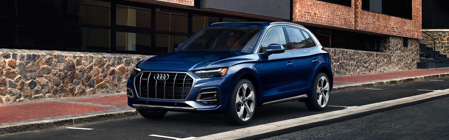 Angled view of the 2021 Blue Audi Q5’s  front side
