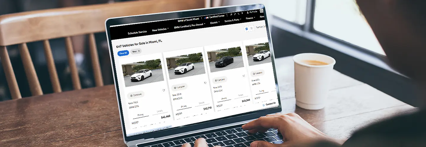 new car shopping on laptop at BMW Miami