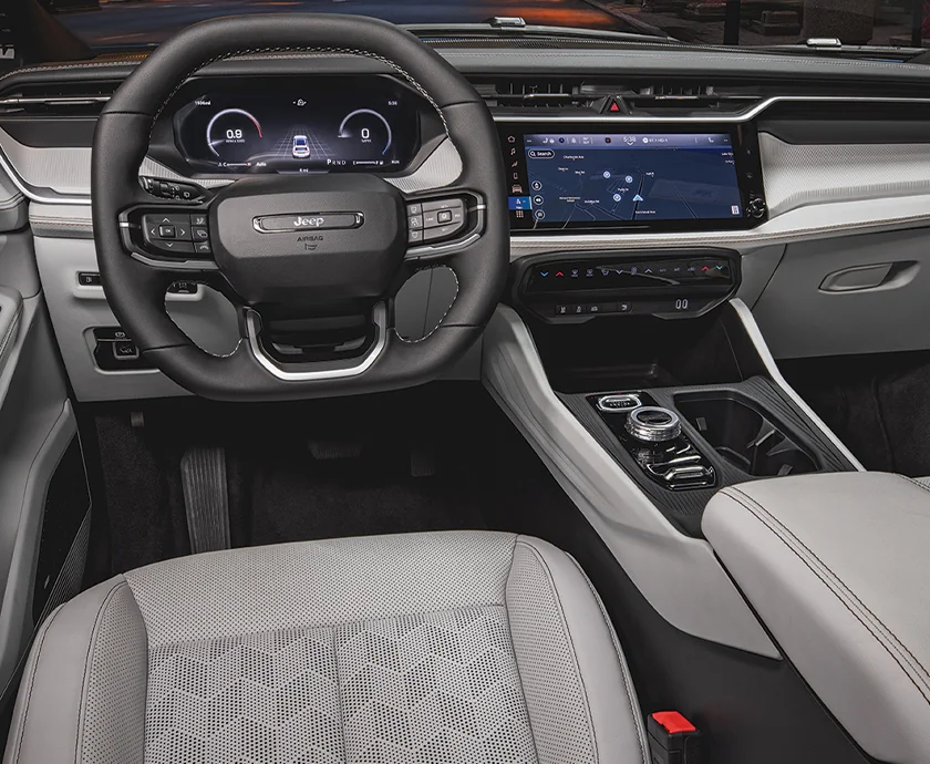 Interior view of the dashboard and tech of a 2026 Jeep Cherokee Hybrid