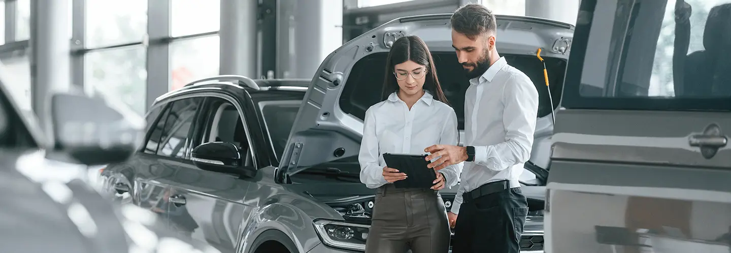 people shopping for a new car at our dealership showroom