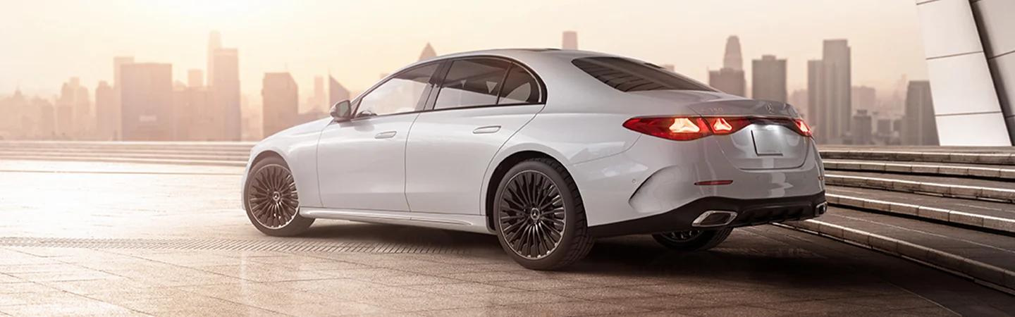 2025 Mercedes-Benz E-Class 350 parked with city skyline in view