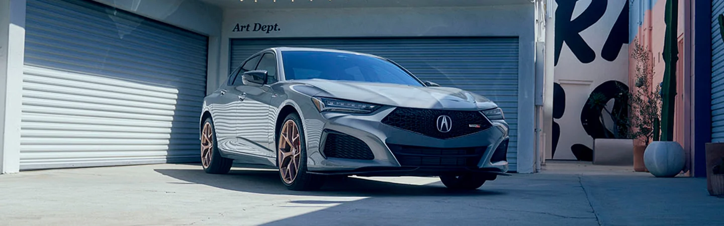 Front view of a 2025 Acura TLX parked in ally