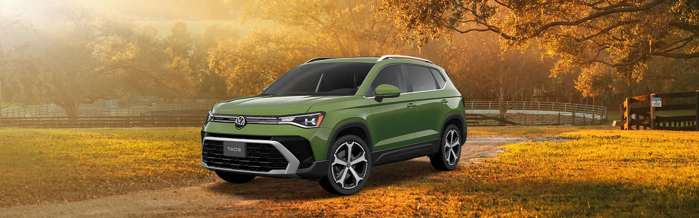 2025 Volkswagen Taos parked on a farm road