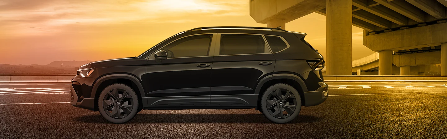 2025 Volkswagen Taos parked in a city under an overpass