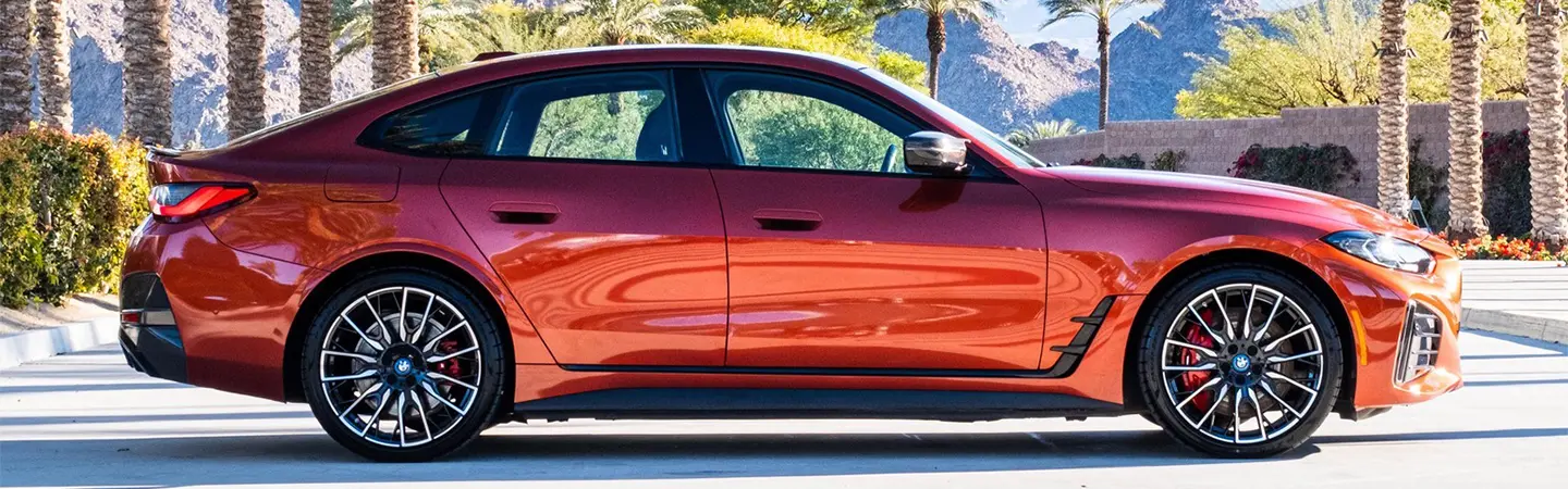 2024 BMW i4 Specs side front in white
